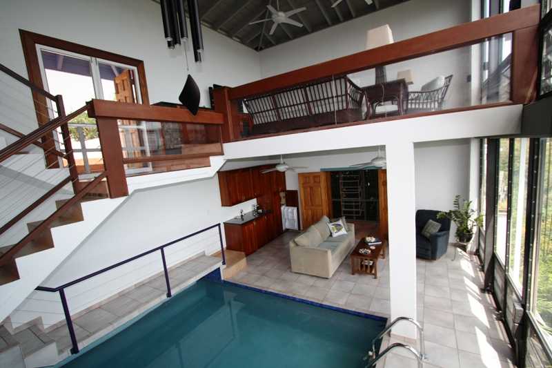 looking towards the upper living room and pool bar area